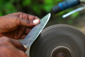 sharpening the knife with whetstone