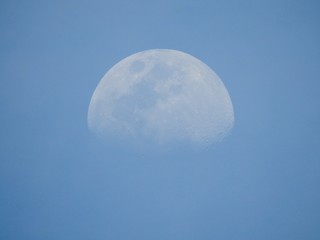 Our Beautiful Day Moon over Blue Skies