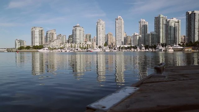 False Creek Dockside, Vancouver. A dolly shot of False Creek and the skyline of Yaletown. Vancouver, BC.

