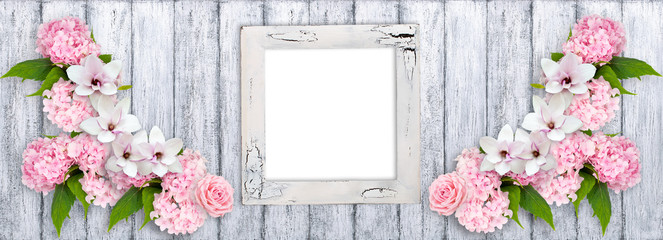 Photo frame with magnolia flowers, roses and hortensia © julia_arda