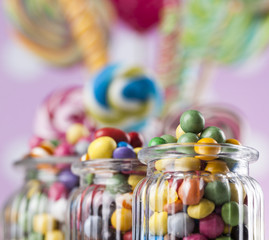 Fototapeta premium Glass jars in Colorful candies,lollipops and gum balls