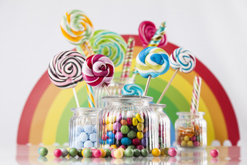 Glass jars in Colorful candies,lollipops and gum balls