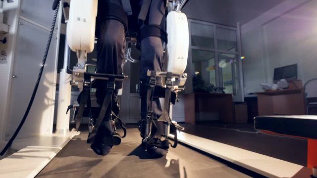 Male tester's feet during treadmill walking exercise. 