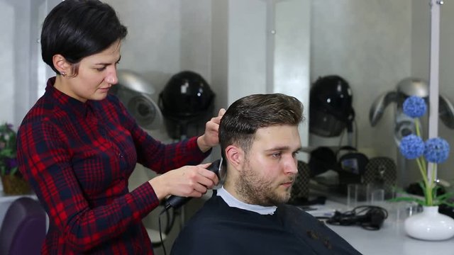 The young man at the hairdresser salon hairstyle make model 