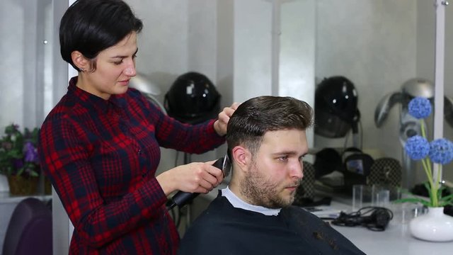 The young man at the hairdresser salon hairstyle make model 
