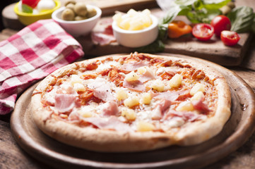 Wood Fired Gourmet pizza with a topping of Ham and Pineapple