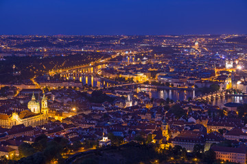 Fototapeta na wymiar Prague at twilight blue hour, view of Charles Bridge on Vltava with Mala Strana, Old Town and Prague castle