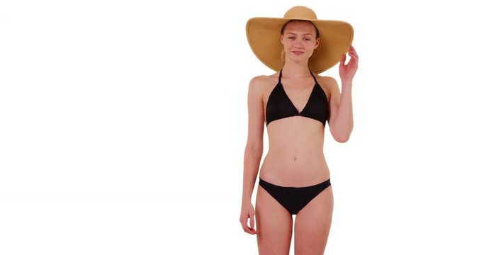 Happy smiling woman in sunhat and swimsuit on white background with copy space