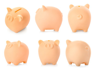 Different views of piggy bank on white background