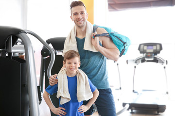 Dad and son spending time in gym