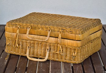 The old wicker basket with the lid and handles