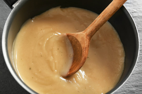 Fototapeta Tasty turkey gravy in saucepan