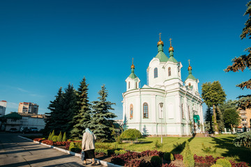 Brest, Belarus. Elderly Woman Walking Near Simeon's Stylites Cathedral Church