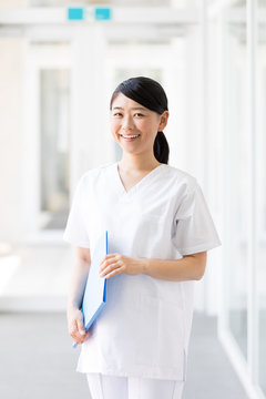 portrait of young asian nurse in hospital