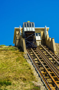 Cliff railway, funicular cable lift railway, in the seaside village, great rock blocks, high cliff