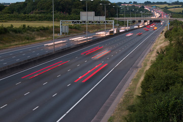 Traffic on the motorway at the dusk time