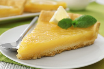 A piece of lemon pie served on plate