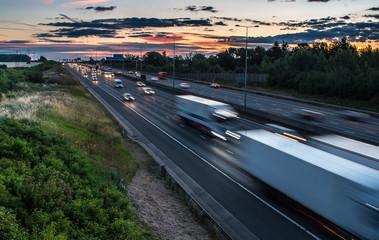 Traffic on the motorway at the dusk time