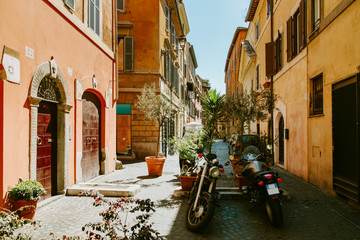 Narrow street in Rome, Italy at summer