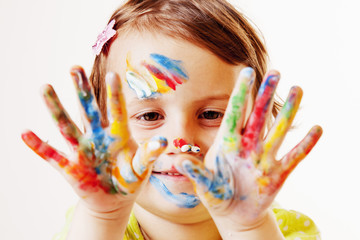 Beautiful little child girl and the painted hands. (art, people, childhood, color, drawing concept)