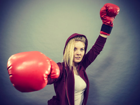 Woman winner wearing boxing gloves