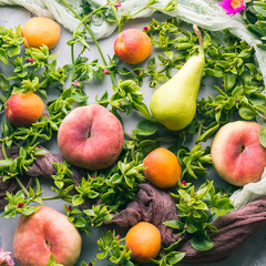 Fresh summer fruit concept still life - peaches, apricots and pears