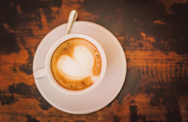 Coffee cup of Cafe' latte with heart latte art on top