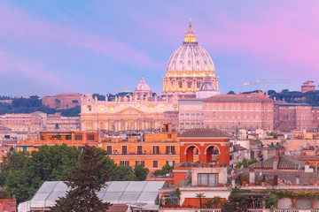Fototapeta na wymiar The view from the Pincian Hill overlooking St. Peter Basilica during beautiful sunset in Rome, Italy.