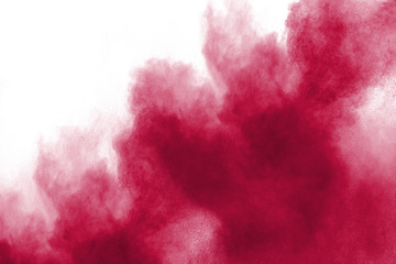 Red powder explosion on white background.