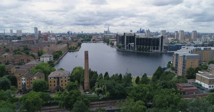 Aerial approaching view of the Millwall outer dock in the financial district of the Docklands in London