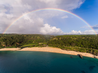 Aerial view of Waimea bay with a full rainbow on the north shore of Oahu Hawaii - 163201565