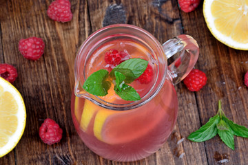 Fresh raspberry lemonade with mint in a pitcher