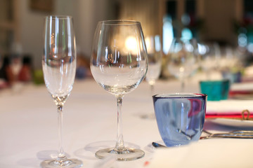 Wine glass set up on the table in luxury dinner party, Blurry background.