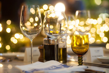 Blurry background of wine glass set up on the table in luxury dinner party.