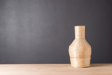 Wicker rattan vase from bamboo for decoration background