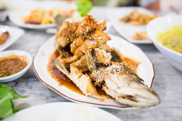 Deep Fried Sea Bass with Sauce on white dish,Thai food.