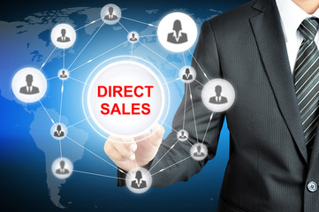 Businessman hand touching DIRECT SALES sign on virtual screen