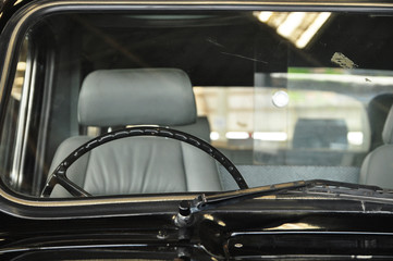 The cabin of black old and vintage car.