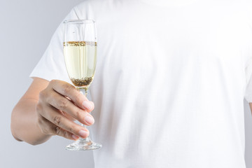 Hand holding glass of champagne with pest or insect