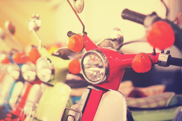Red vintage motorcycle in retro style tone.