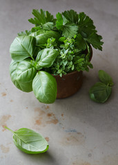 Bunch of fresh herbs in a small bowl