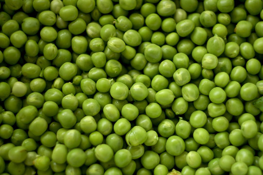 Green peas close-up may be used as background 