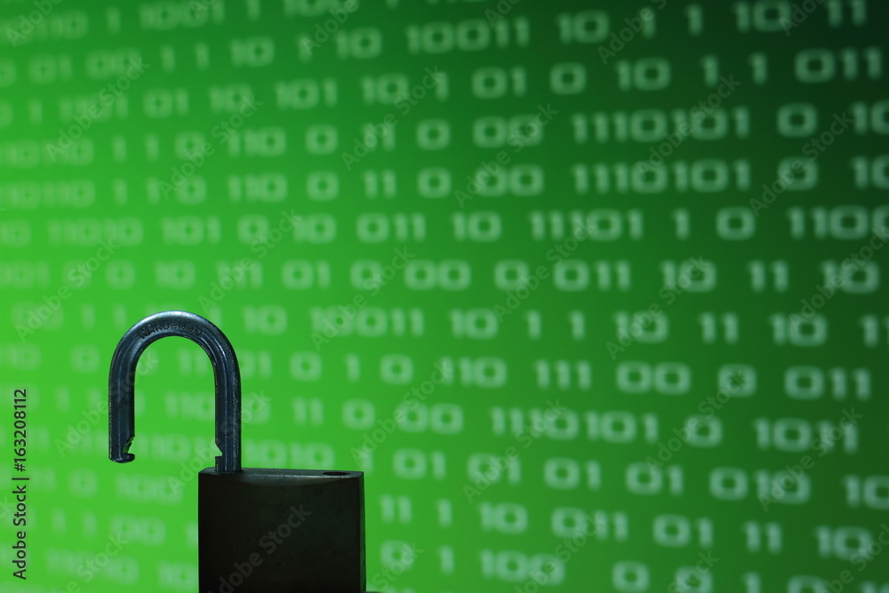 Poster unhacked safe from virus and ransom ware unlock in front of green binary computer code screen digita