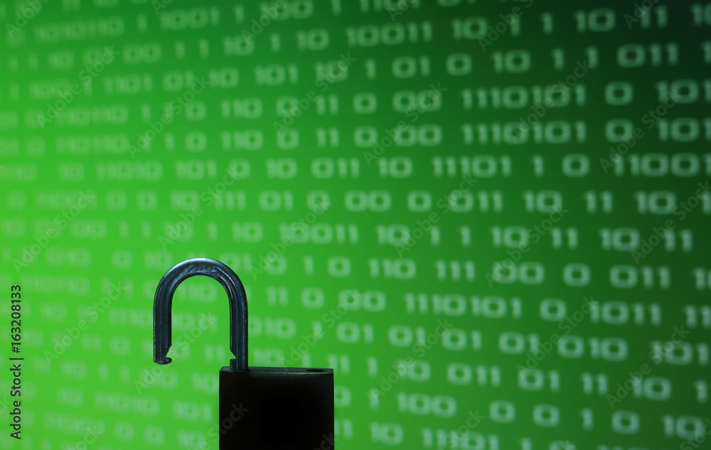 Poster unhacked safe from virus and ransom ware unlock in front of green binary computer code screen digita