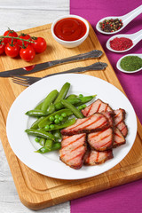 grilled meat and cooked green pea pods