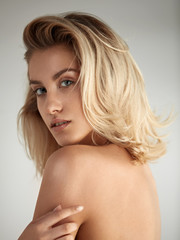 Closeup portrait of a beautiful blond young woman