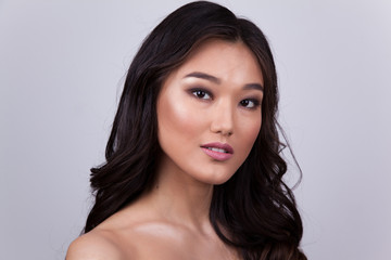 Fototapeta premium Portrait of a beautiful asian woman with naked shoulders.