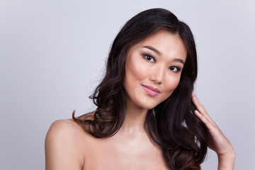 Portrait of a beautiful asian woman with naked shoulders.