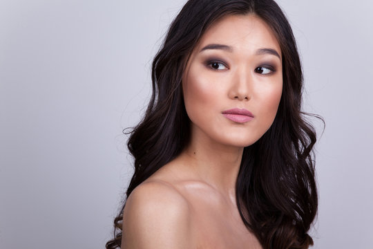 Portrait of a beautiful asian woman with naked shoulders.