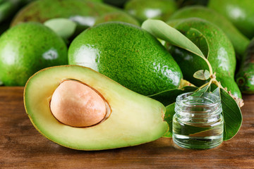 Fresh ripe green avocados and natural avocado oil. Home spa